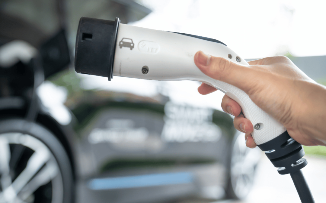 person holding ev charger in orange county