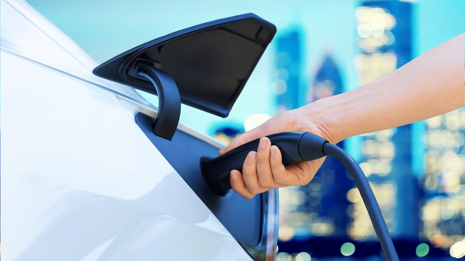 person using free ev charging station in california