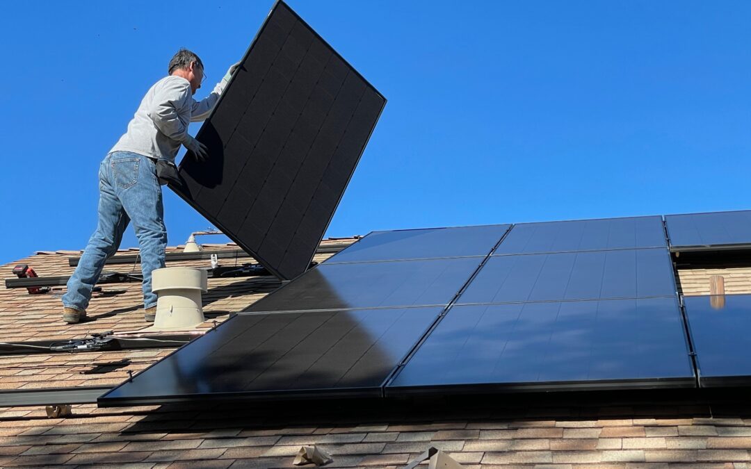 orange county solar installer placing solar panel power panel for business