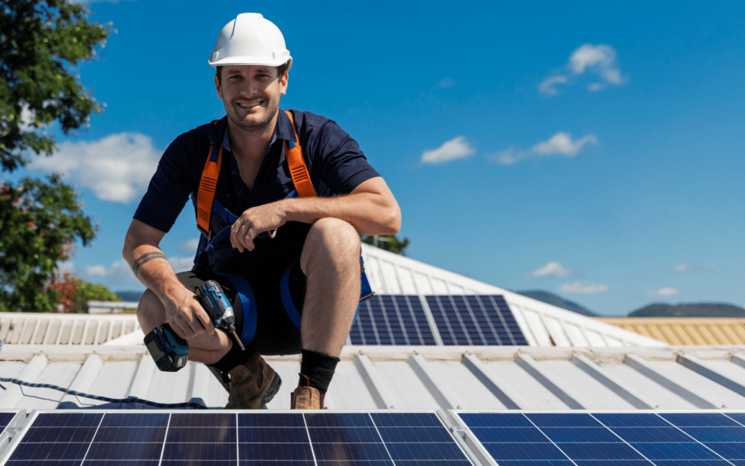 orange county solar panel installer sitting on roof