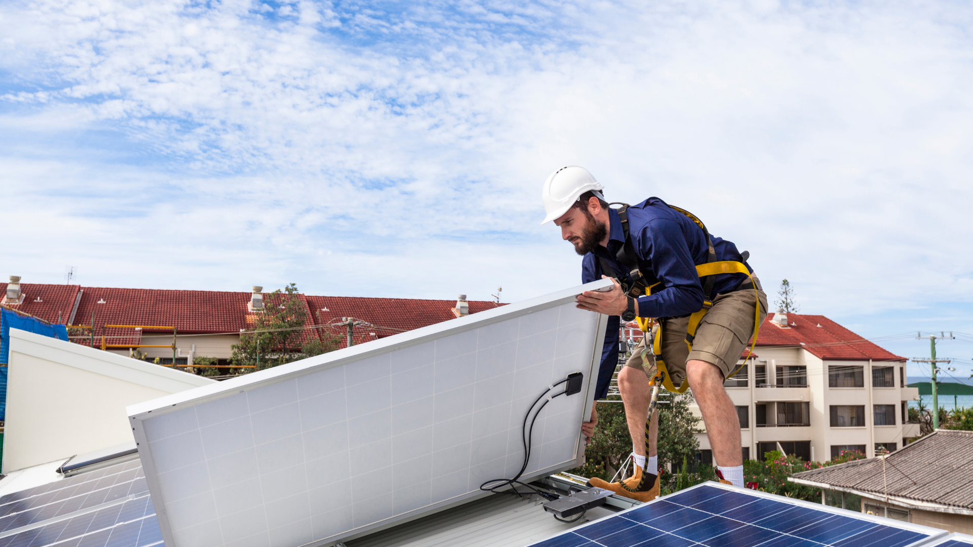 orange county commercial solar installer putting solar panel on new roof