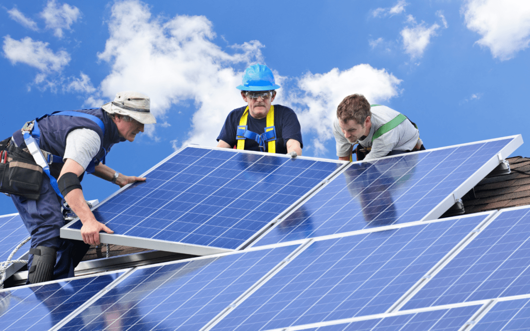 employees of the best orange county solar company installing solar panels on roof