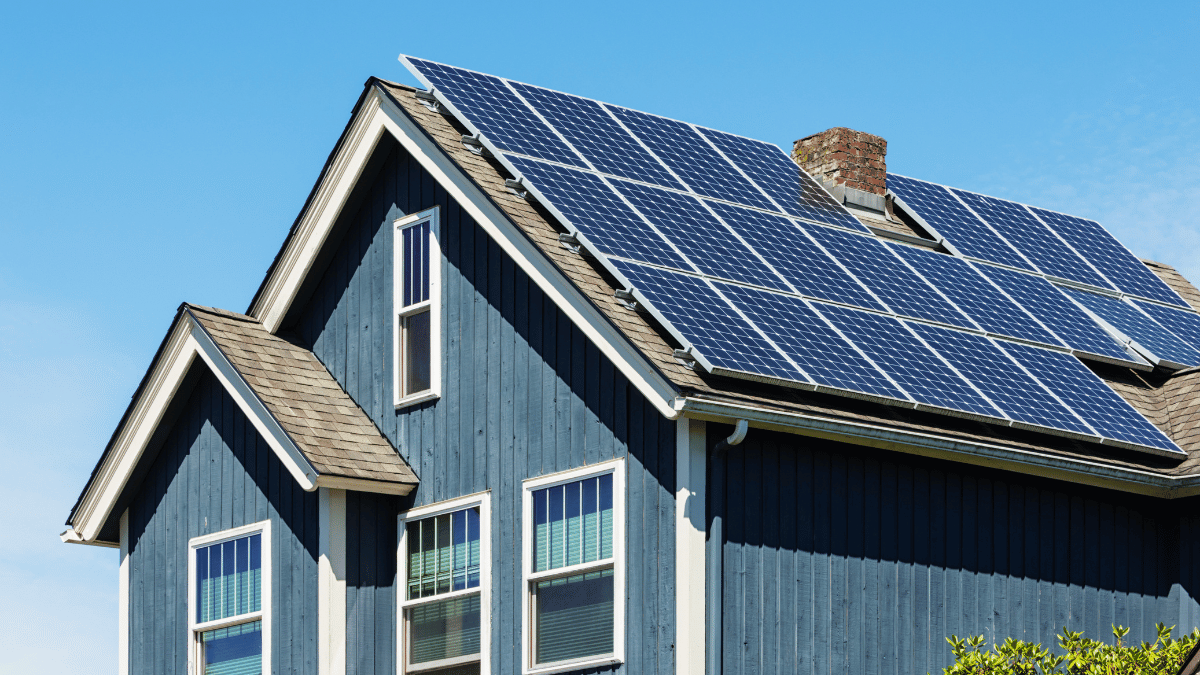 leased solar panels in orange county on roof of blue house