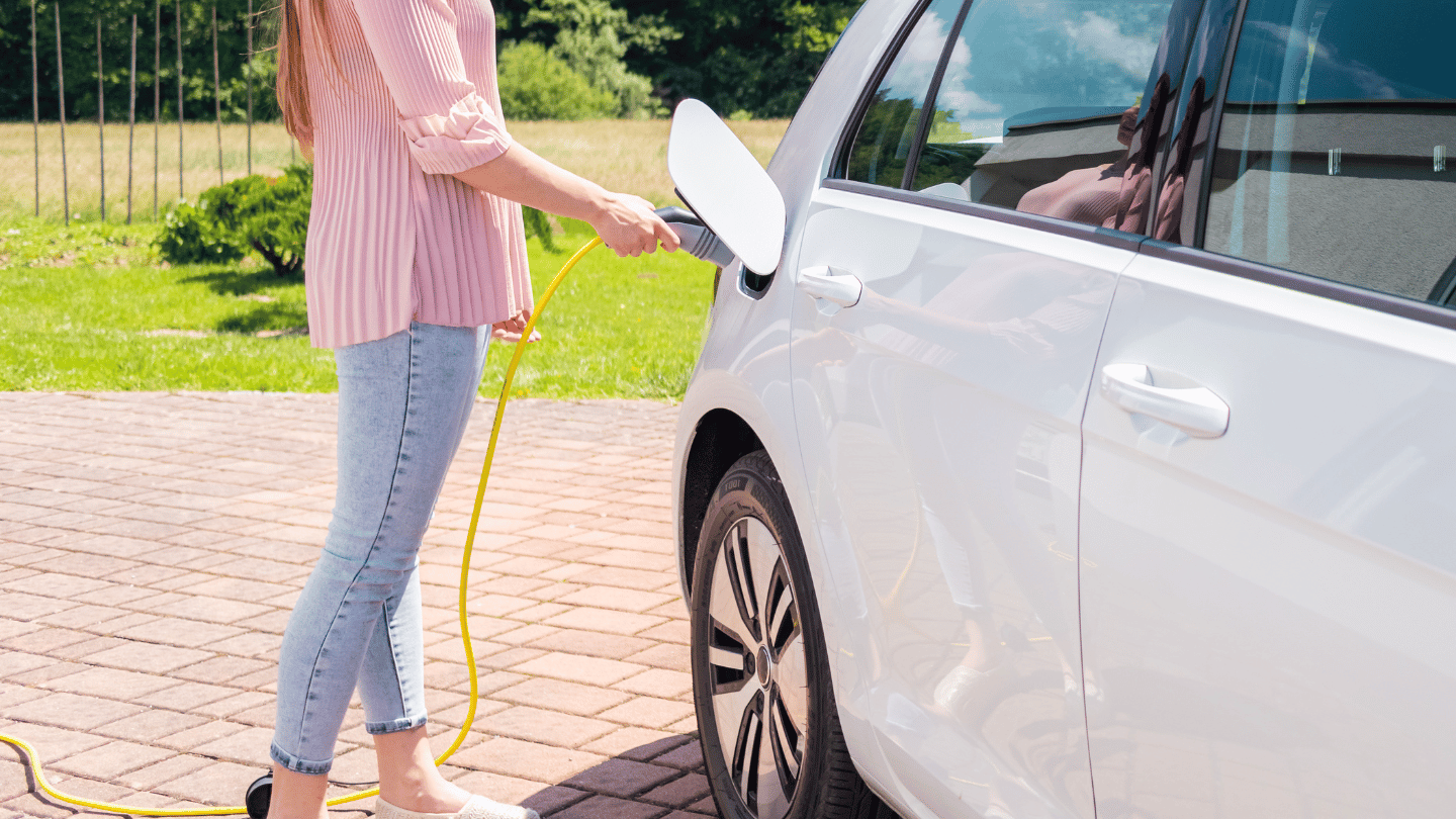 woman using a commercial ev charger in anaheim